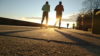 two men running at park