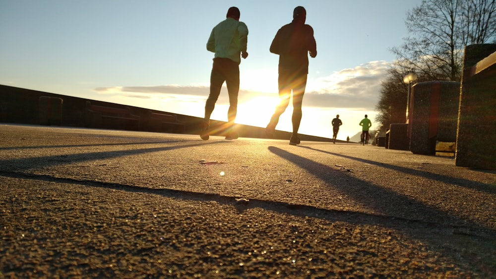 two men running at park