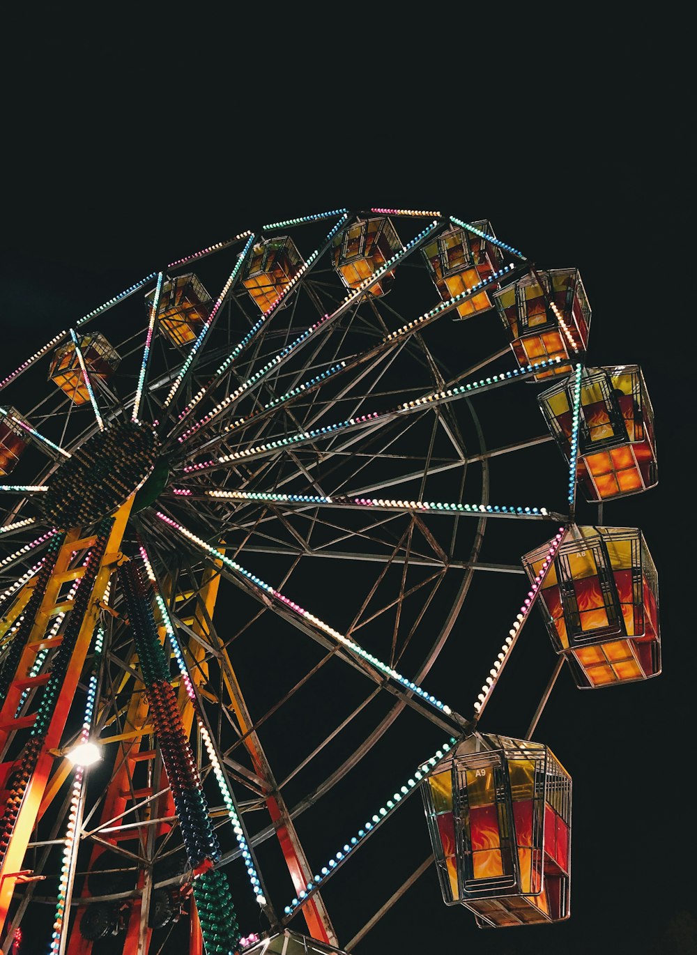 worm's eye view photography of ferris wheel during night