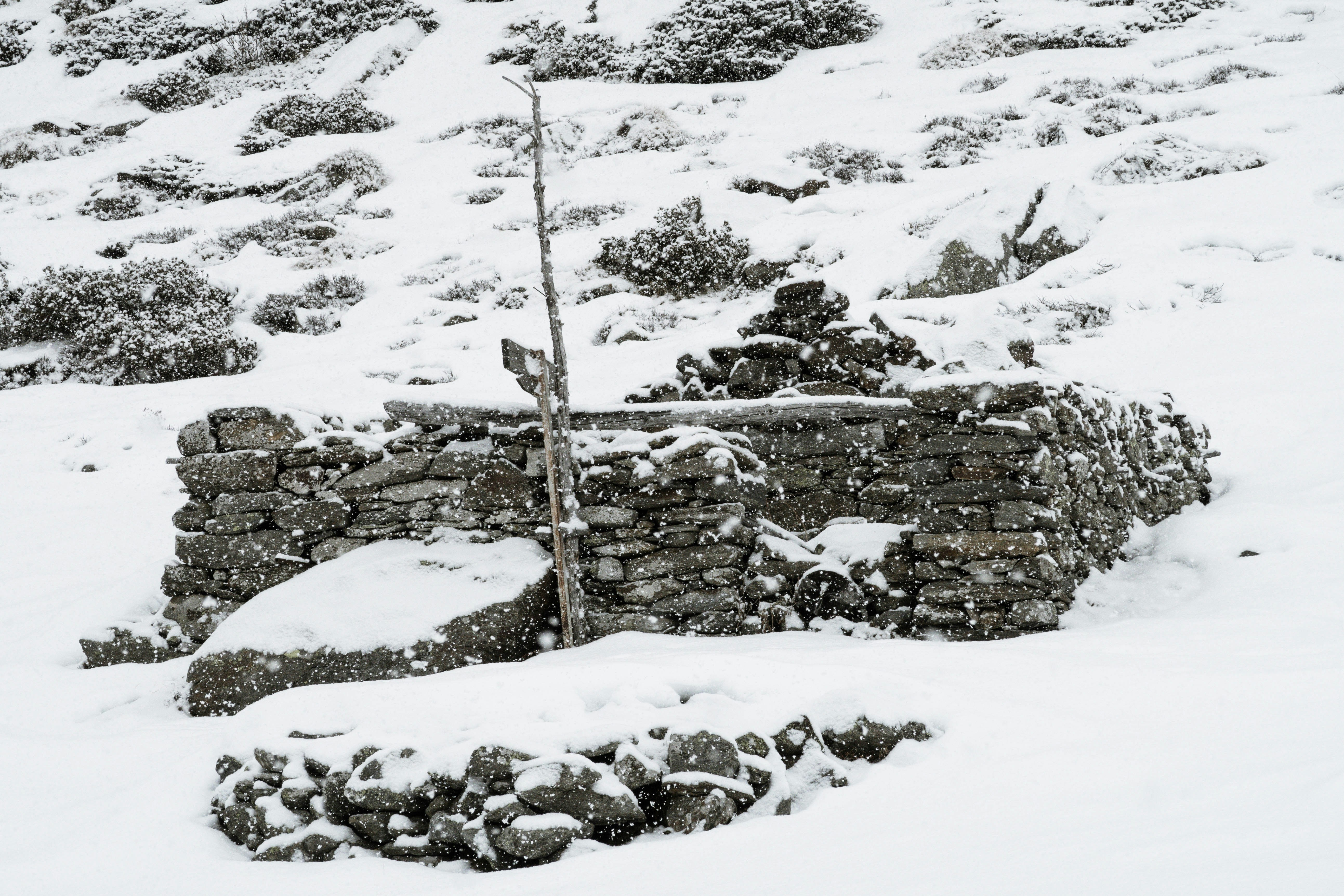 snow shovel by wall after storm