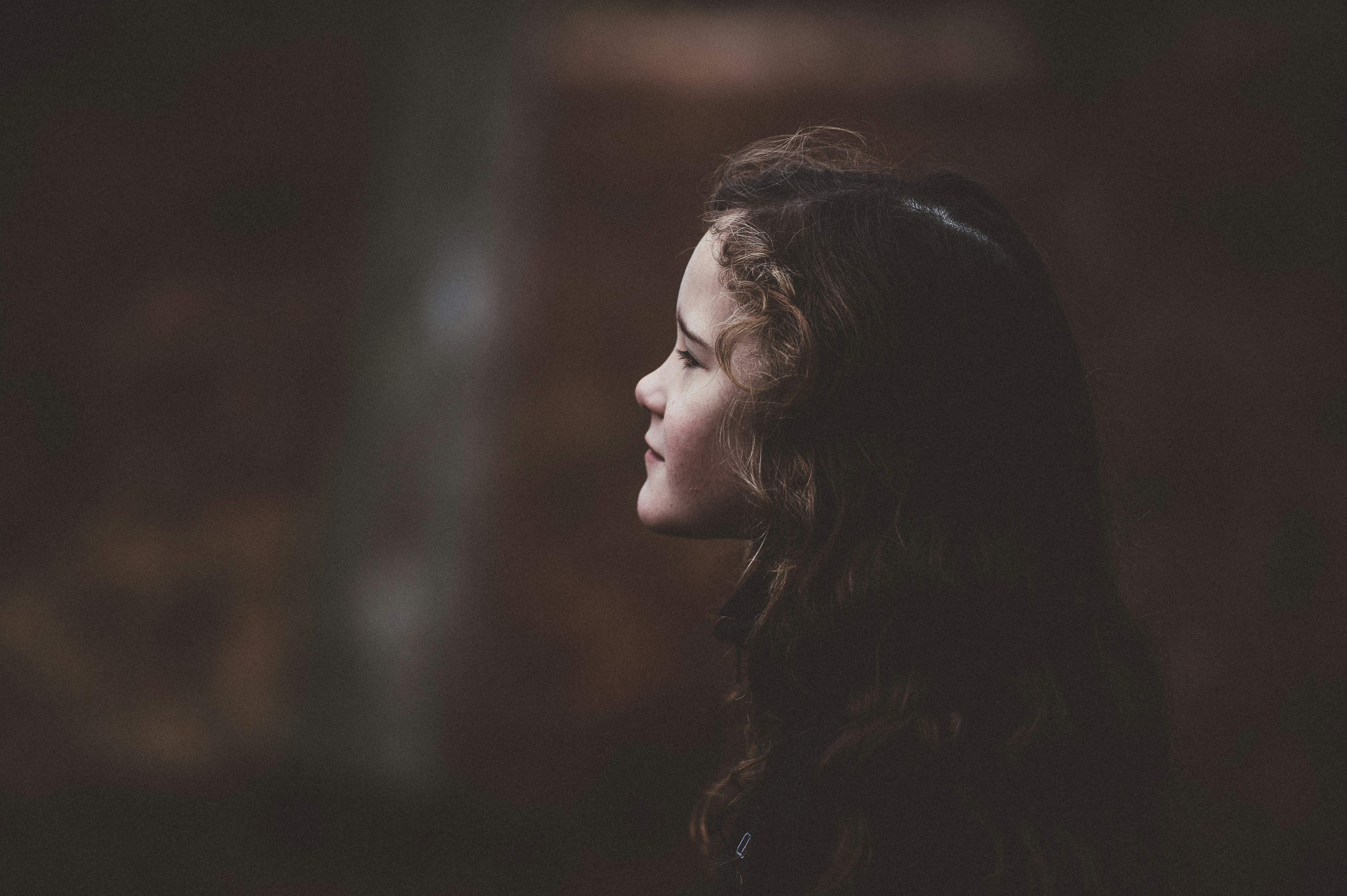 selective focus photography girl wearing black shirt