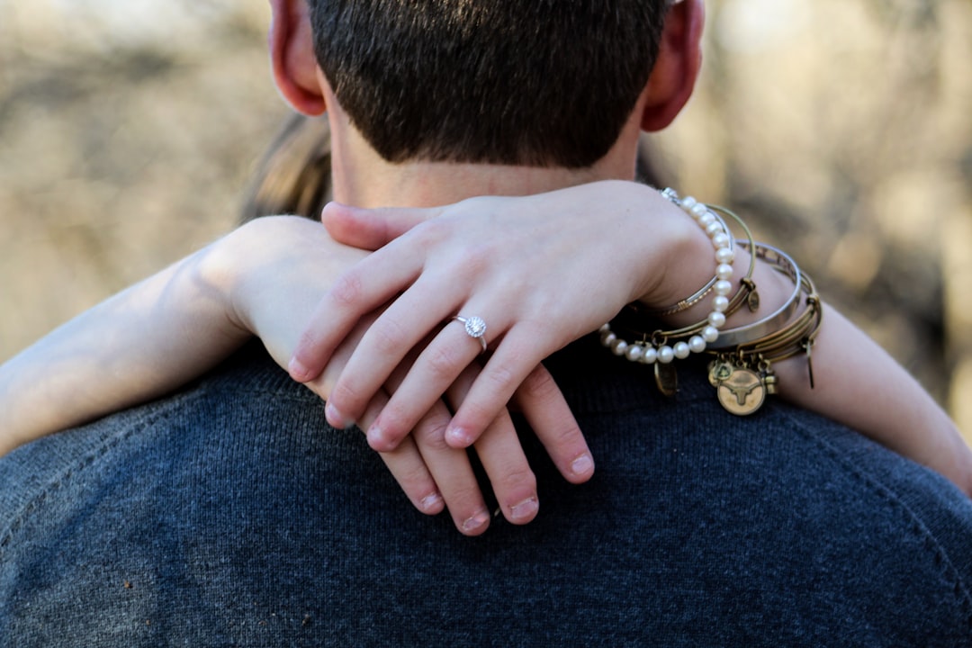 selective focus photo of couple hugging