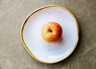 Apple on white plate