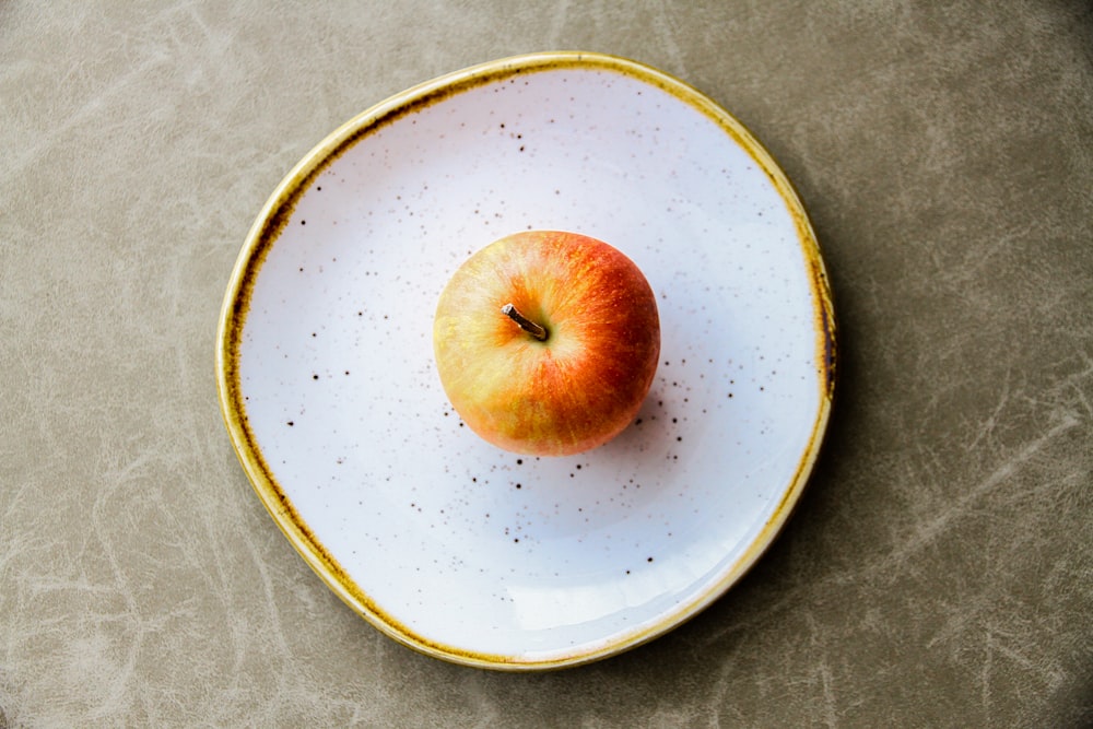 Apple on white plate