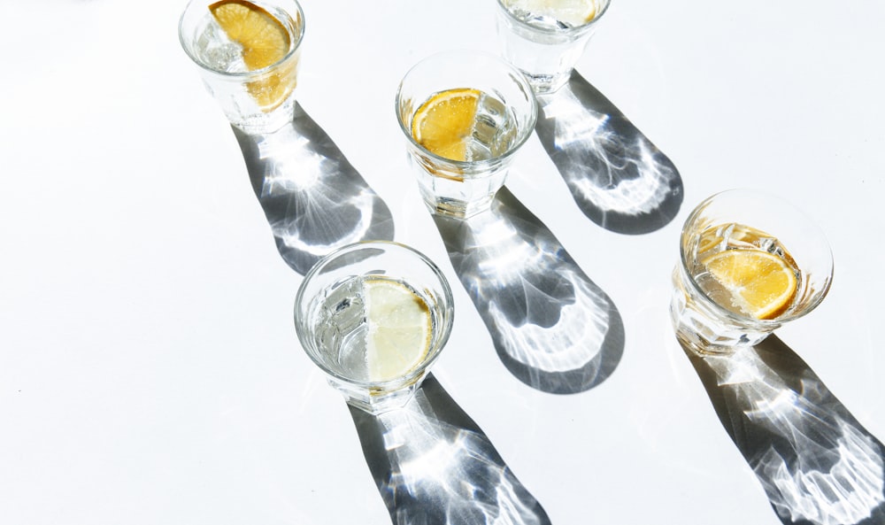 five clear shot glasses