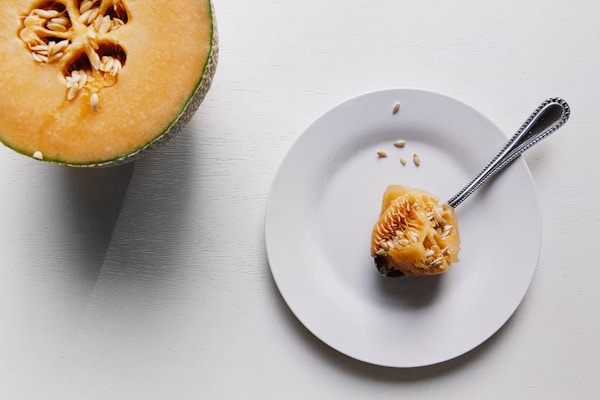 Cantaloupe seeds on round white plate