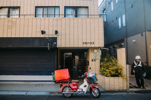 Delivery motorcycle parked outside the pharmacy ready for local deliveries.