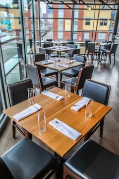 square brown wooden table and chairs