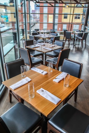 square brown wooden table and chairs
