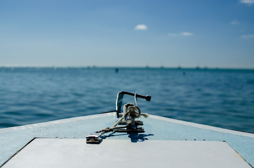 selective focus photography of black rod on boat
