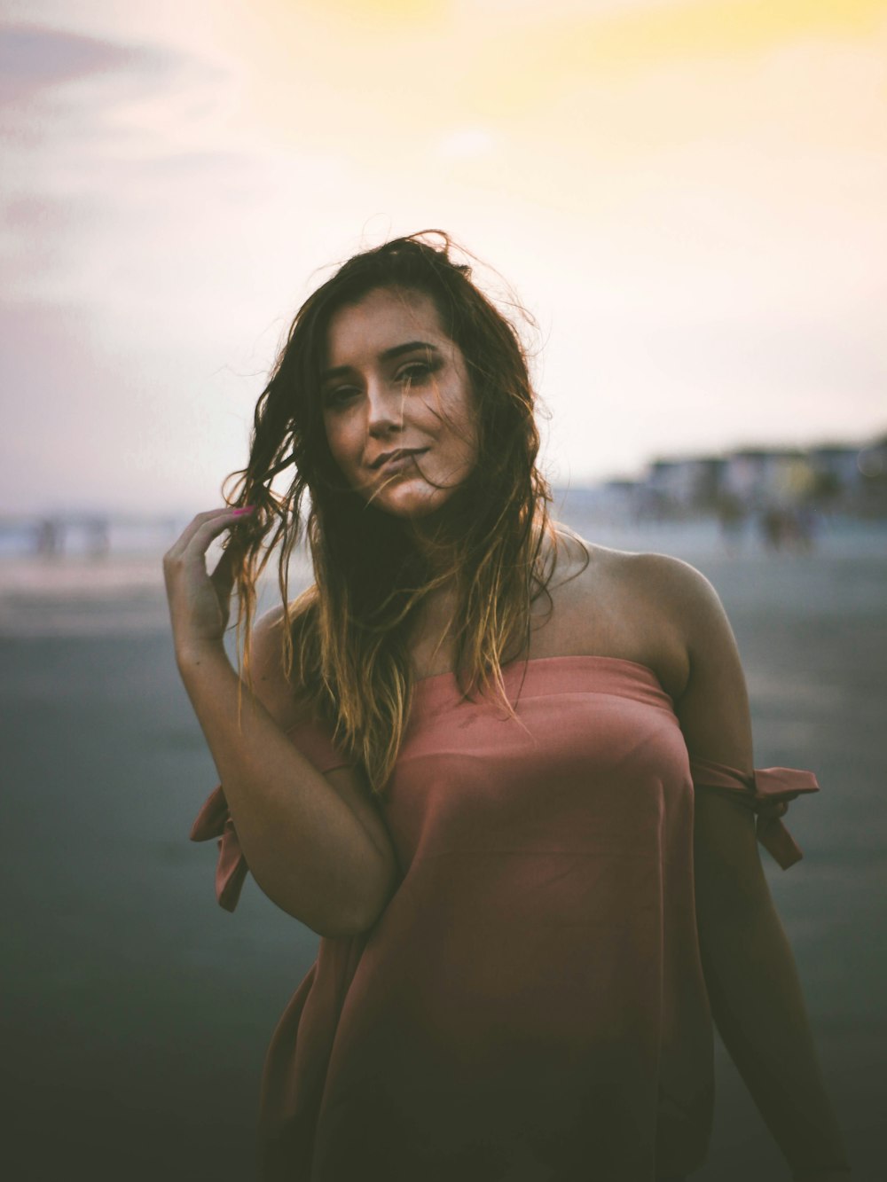 woman holding her hair photo during daytime