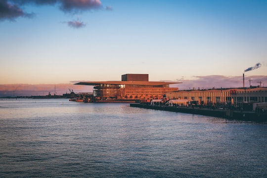 landscape photography of concrete building near river in Copenhagen Opera House Denmark