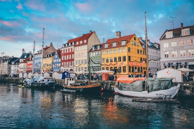 two gray and black boats near dock denmark google meet background