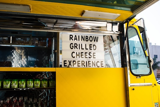 rainbow grilled cheese experience signage