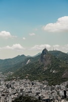 A panoramic view of Rio de Janeiro with Christ the Redeemer statue overlooking the city.