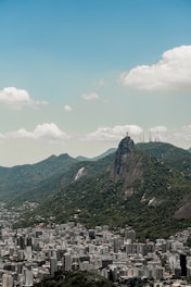A panoramic view of a famous Brazilian landmark surrounded by lush greenery.
