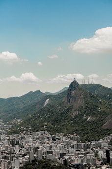 A stunning view of Rio de Janeiro's landscape featuring lush mountains and vibrant beaches.