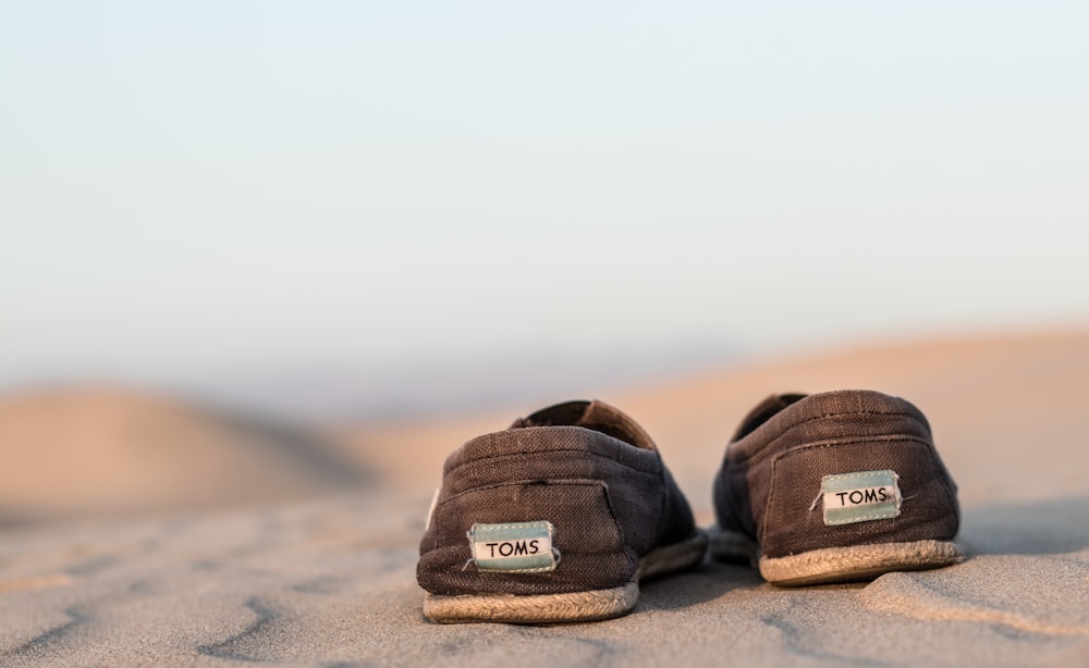 pair off black Toms shoe during daytime photography