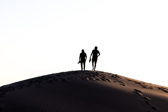 two person walking on desert in Pismo Beach United States