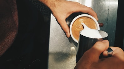 A robotic system frothing milk to creamy perfection.