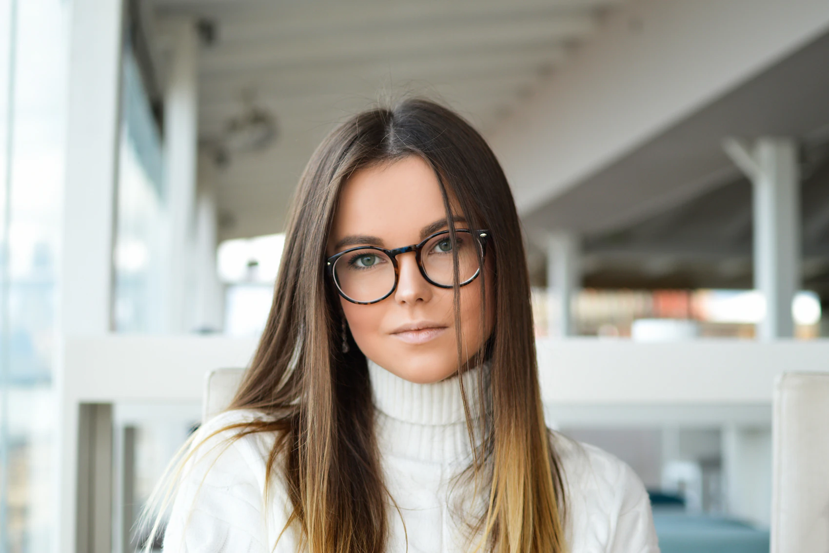 Wearer by a window in PlatinumVision eyewear