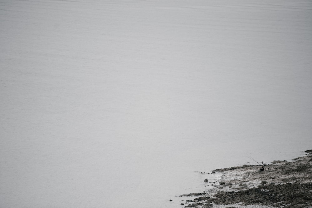 a man riding skis down a snow covered slope