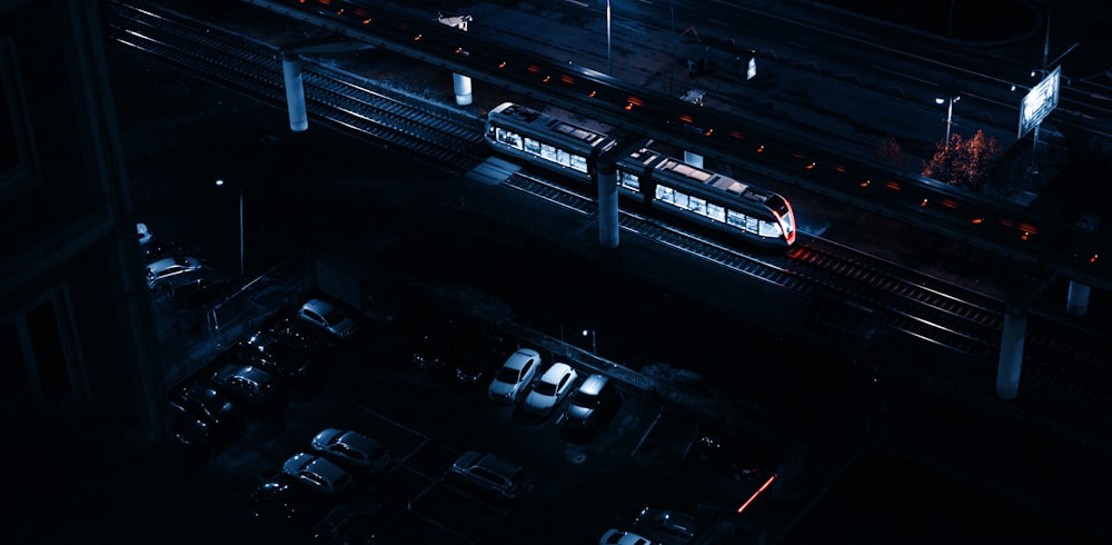 aerial view of piled cars beside train