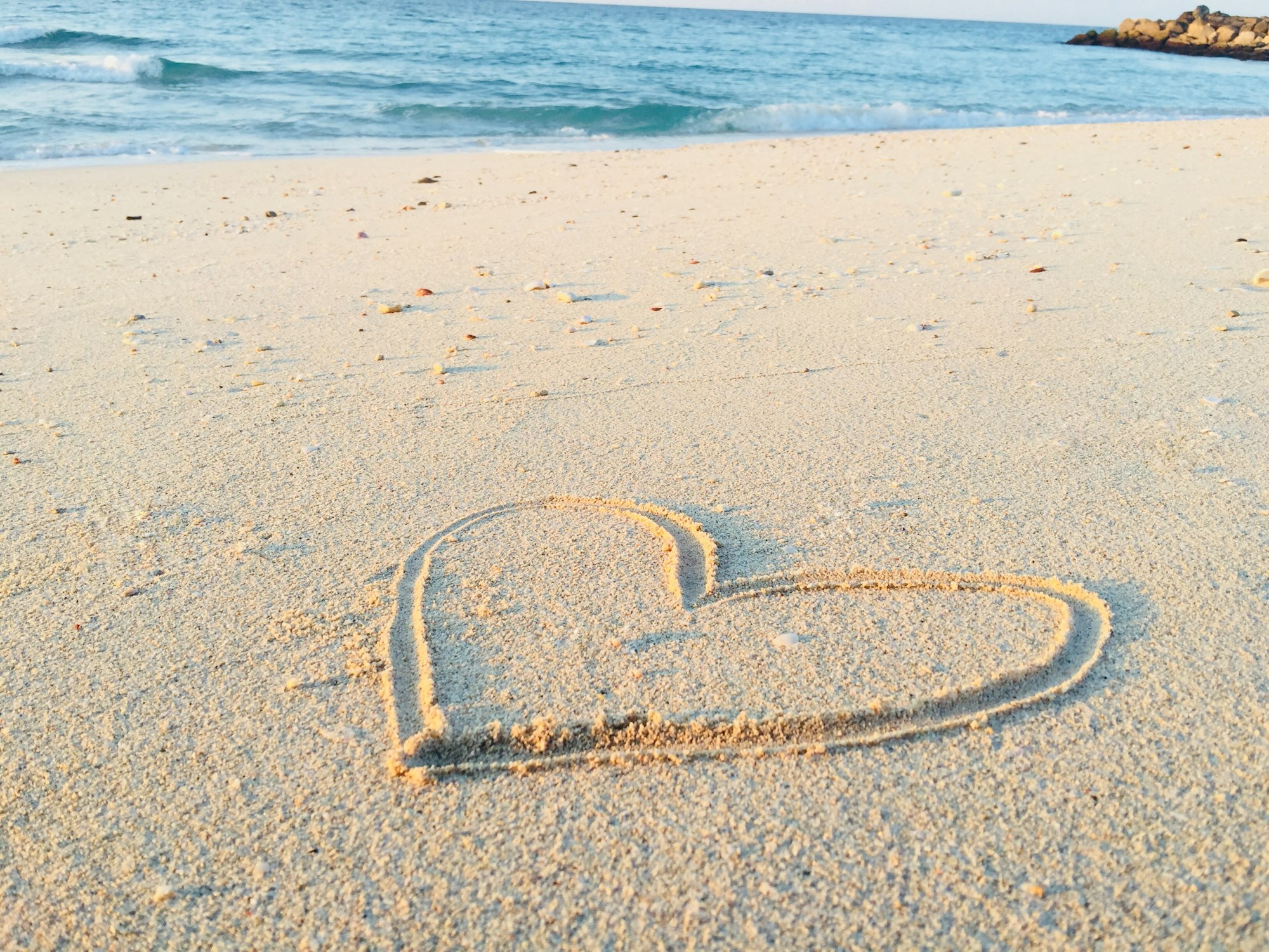 My YouTube Channel ⟹ https://www.youtube.com/c/knowITbyKhadeeja

Walking along the esplanade of Hamriyah Beach, I decided to do something creative and picked up a stick in order to draw a heart into the sand. I immediately clicked a picture of it, as the nature surrounding it was beautiful and soothing.