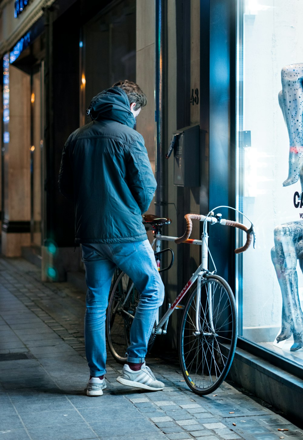 man beside road bicycle