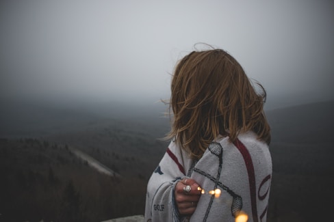 woman covered with white blanket