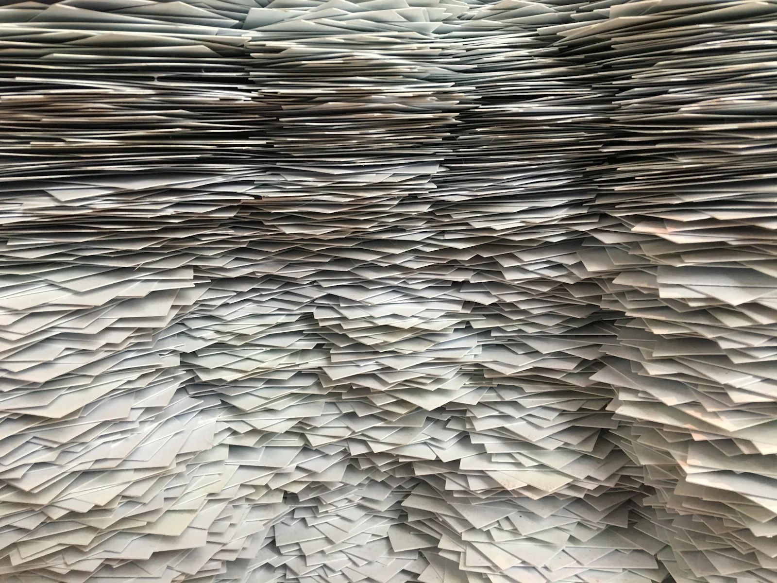 Stacks of case files and paperwork representing the Epstein Files