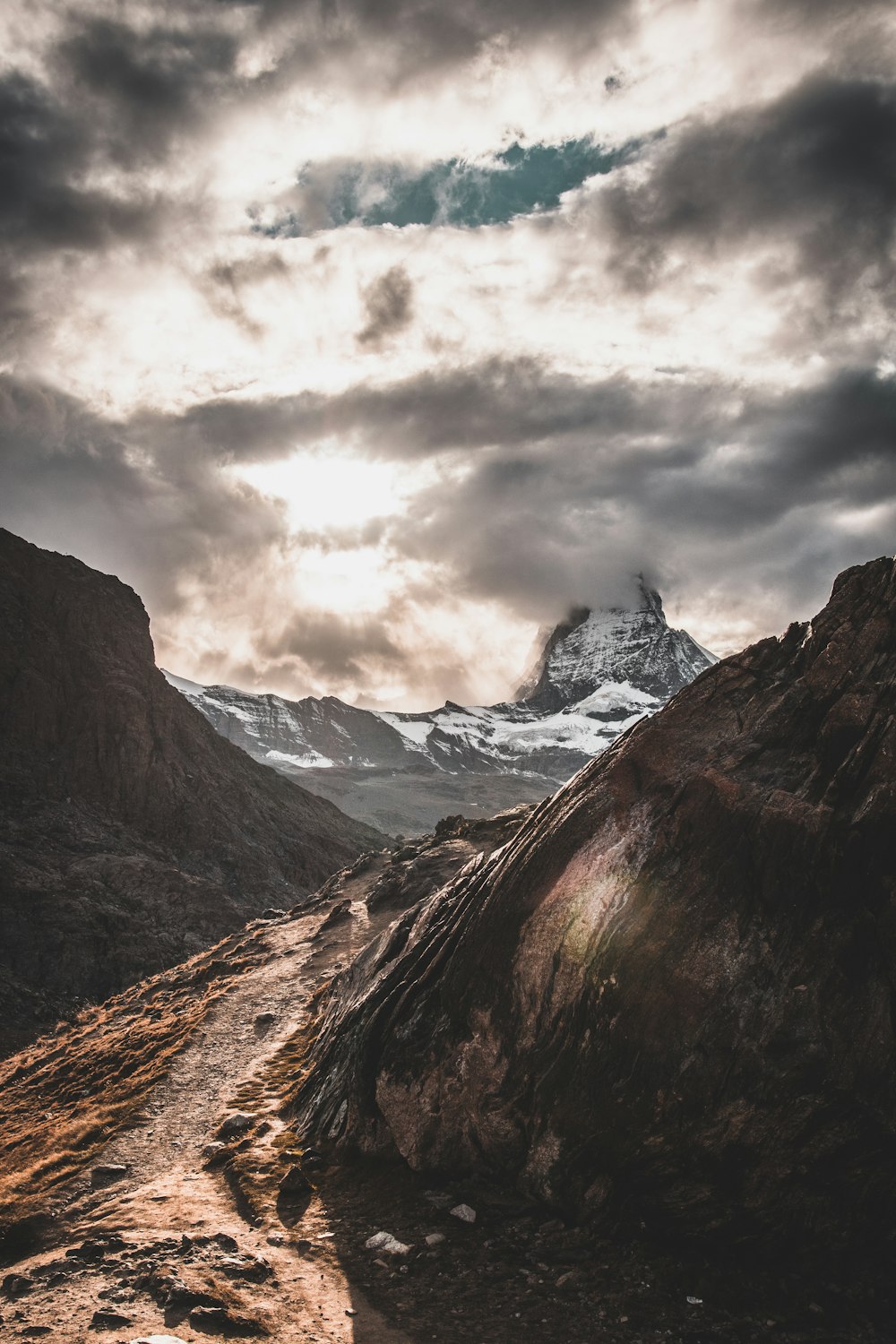 snow covered mouontain under gray sky