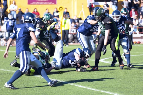 A dynamic football play in action, showing players executing a rapid gash’em offense maneuver on the field.