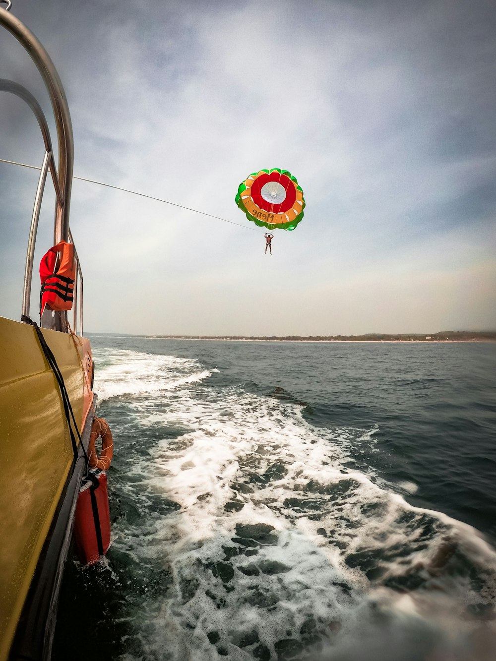 man doing parasailing during daytime