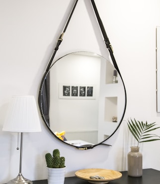 round mirror with black strap