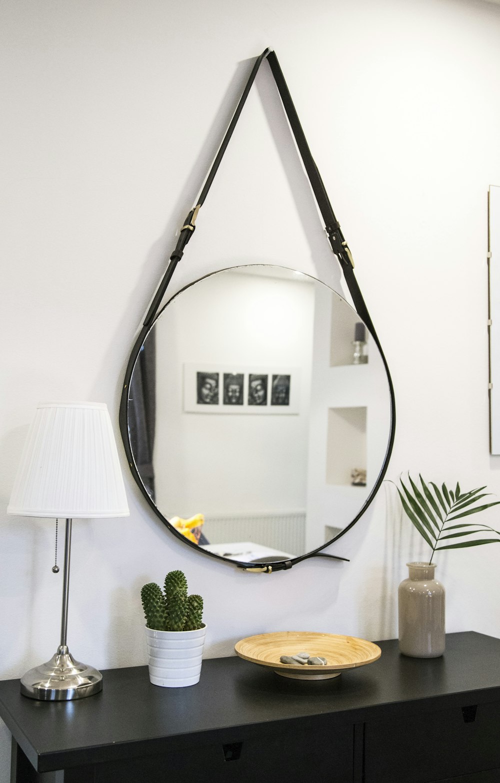 round mirror with black strap