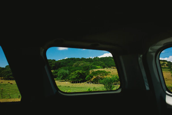 A scenic view of southwest Ohio countryside visible through the van’s window during an interview.