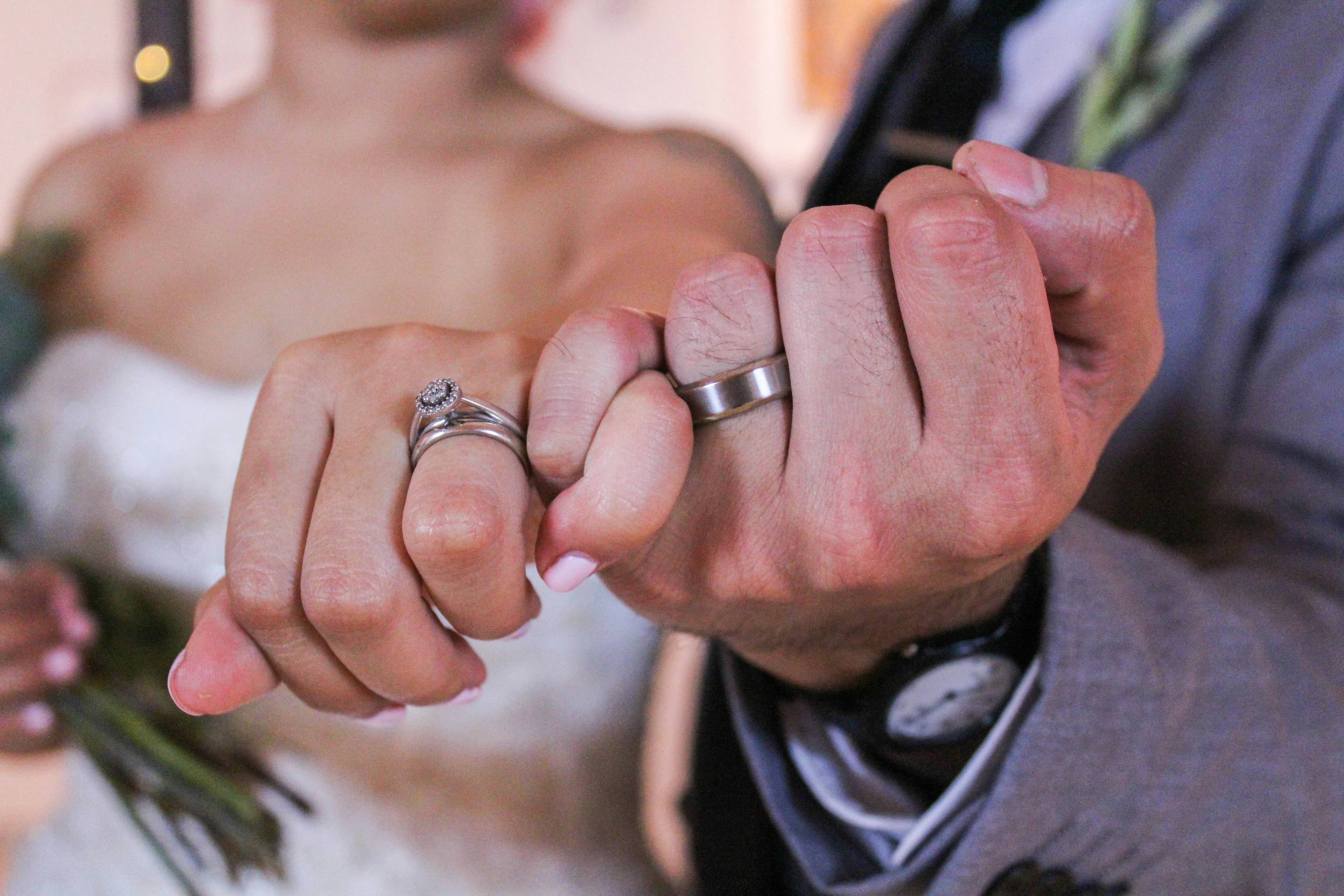 great photo recipe,how to photograph pinkie promise; man and woman showing silver-colored rings