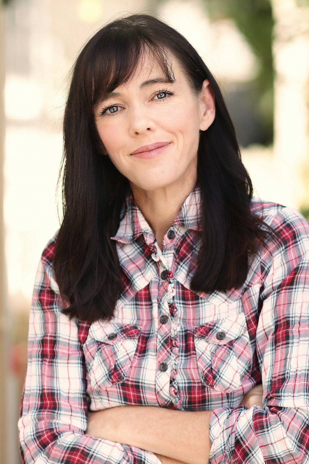 woman in shallow focus while smiling