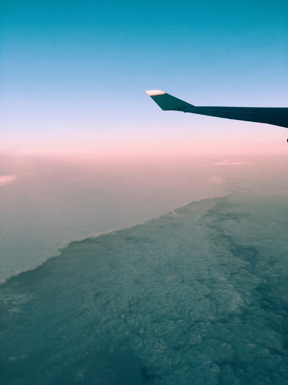 aerial photography of mountain and sea