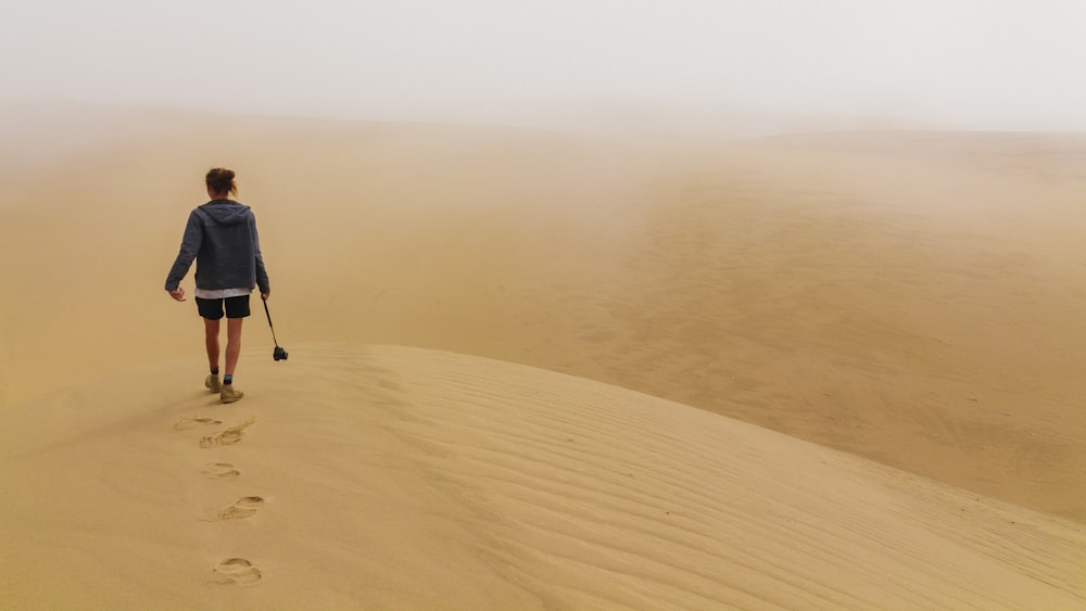 person walking desert place