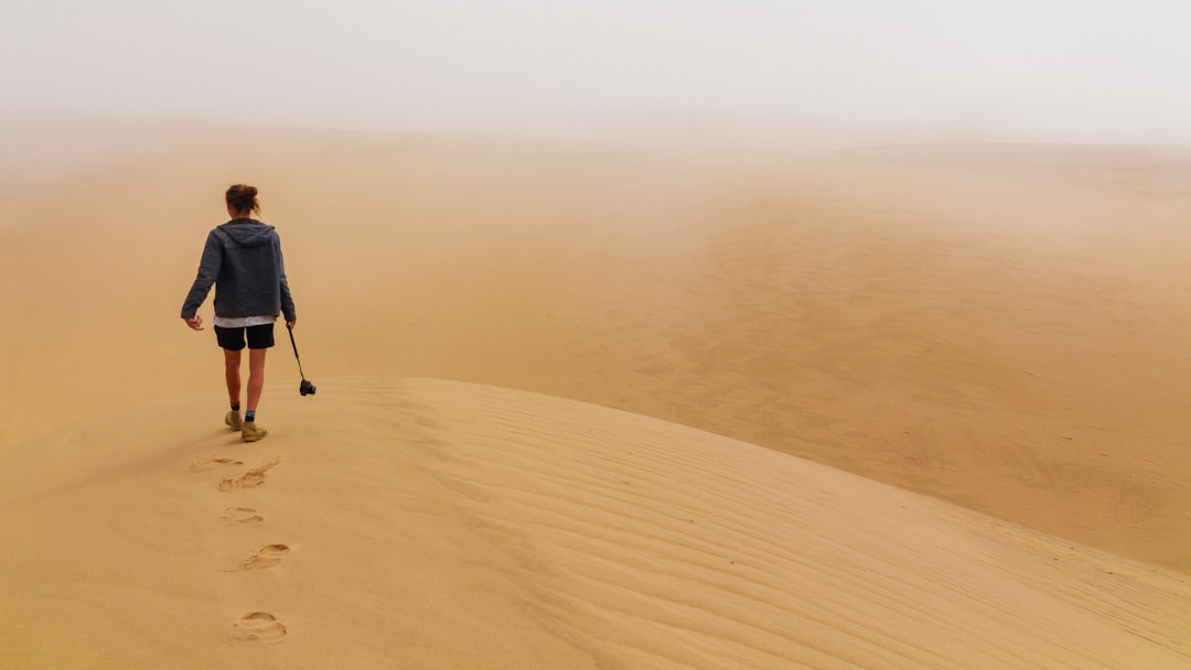 person walking desert place