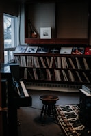 A cozy room with a laptop streaming music and vinyl records scattered around.
