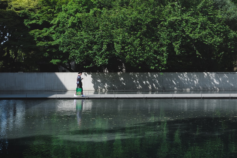 man walking on siidewalk