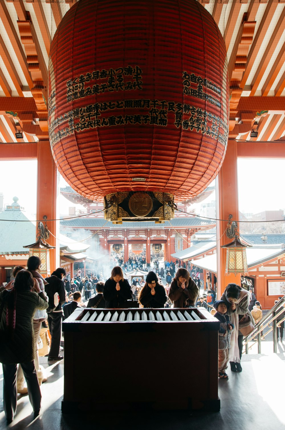 group of peoples near brown wooden table inside park