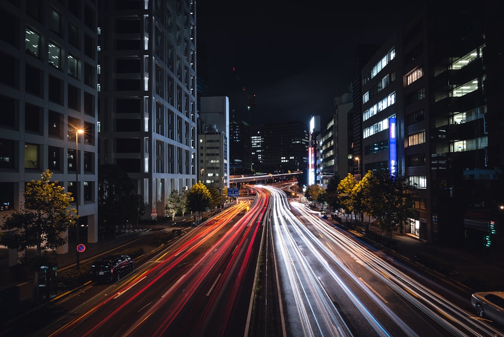 time-lapse photography of road between buildings