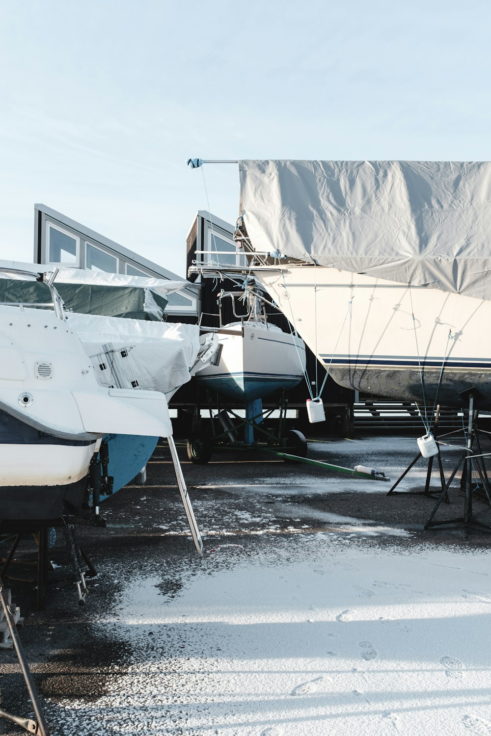 white and blue boat at daytime