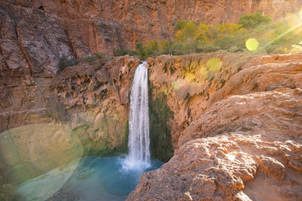 time lapse photography of water falls