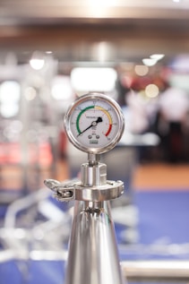 selective focus photography of gauge