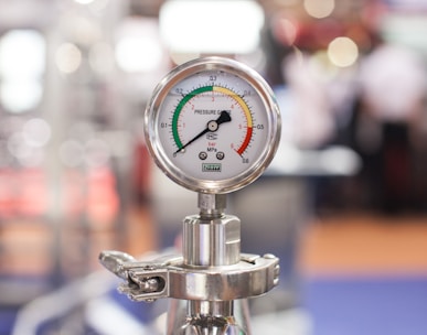 selective focus photography of gauge